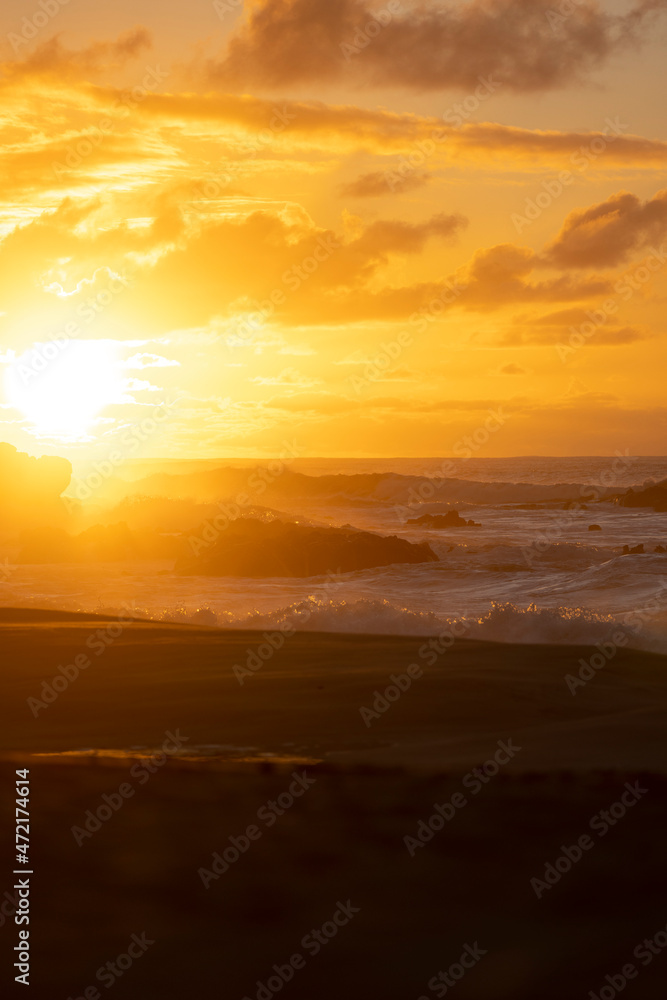 Sunset with ocean waves at Hawaii