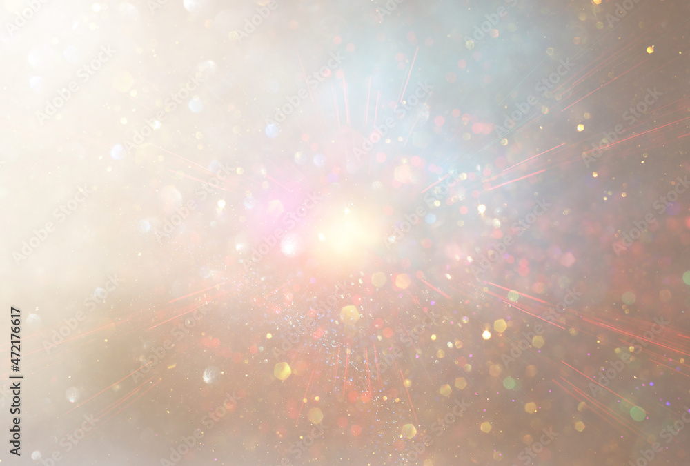 Fototapeta premium background of abstract gold and silver glitter lights. defocused