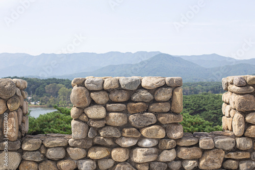 An ancient stone wall made of large stones.