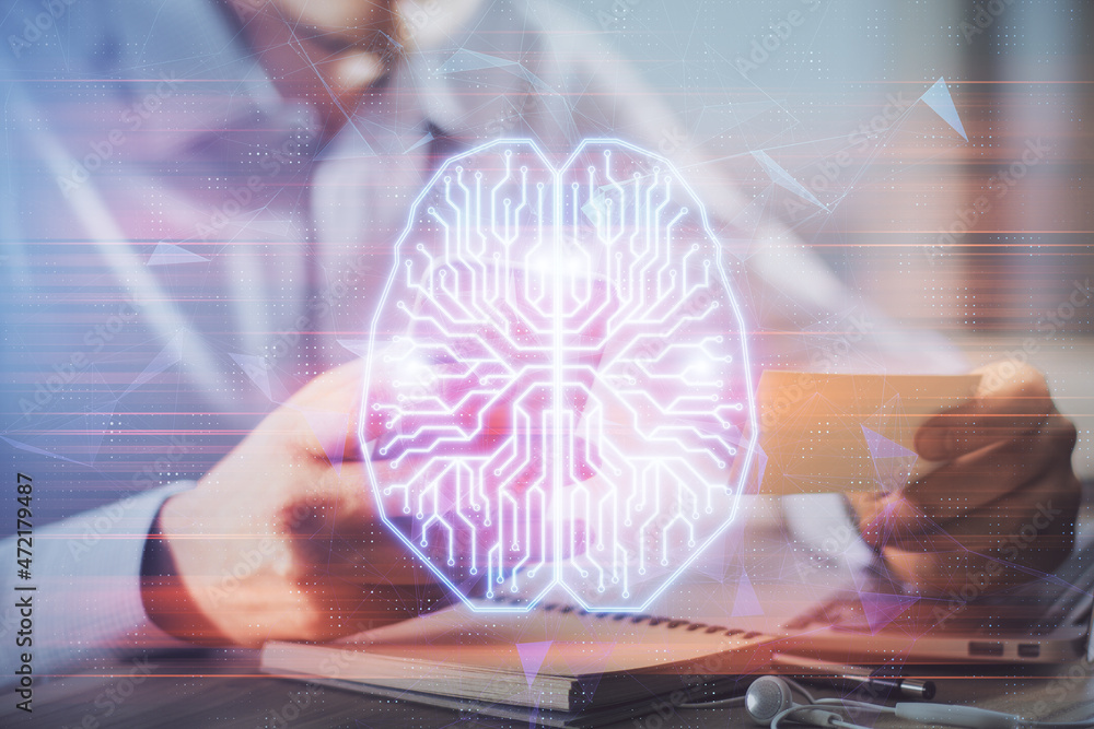 Obraz premium Double exposure of man's hand holding and using a digital device and brain hologram drawing. Data concept.