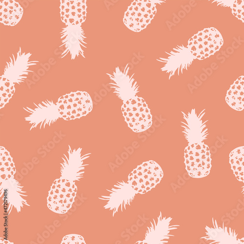 seamless pattern for textiles with pineapples on corral background