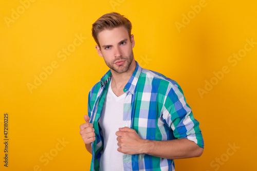 Really handsome. Portrait of young man. Young adult yellow background