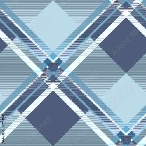 Seamless plaid pattern in dusty navy, light blue and white. All over diagonal repeat.