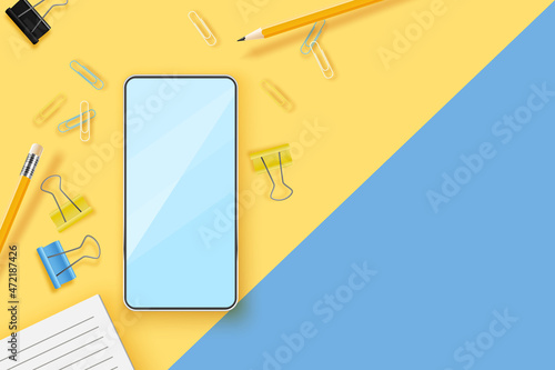 Realistic mobile phone and office supplies on a colored background. Remote work concept. Workplace background