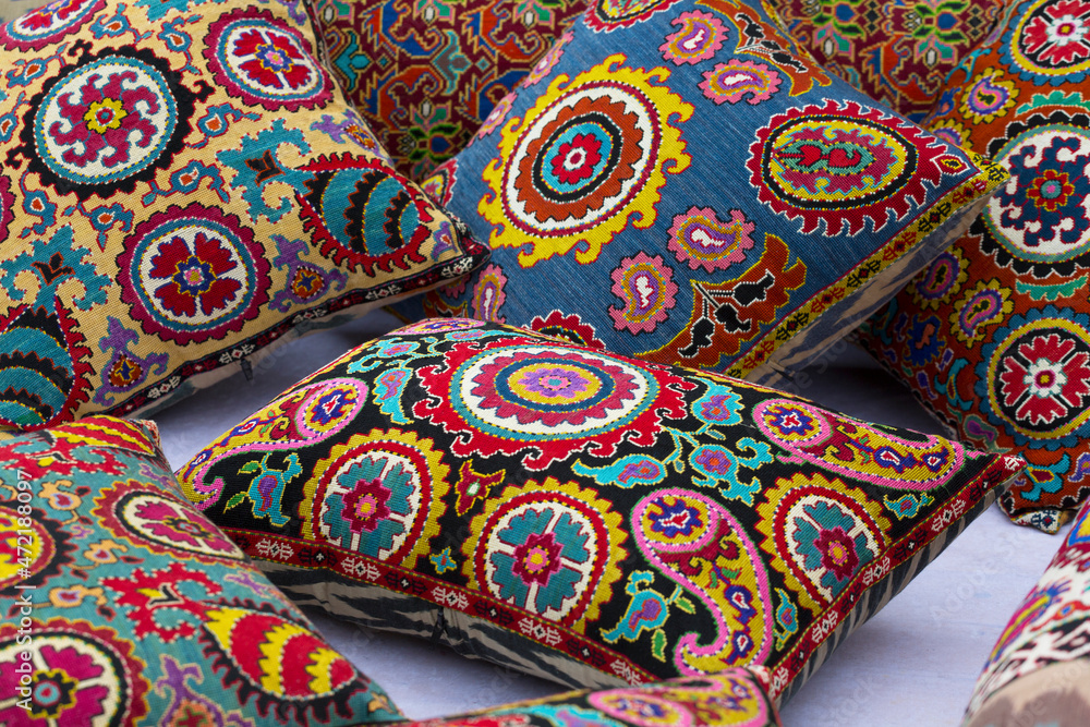 Bright multicolored uzbek pillows close up