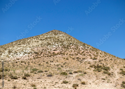 a mountain looks like pyramid in the desert