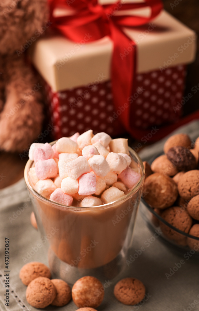 latte, espresso with milk and marshmallows. Festive drink. Dutch holiday Sinterklaas. kruidnoten cookies sweets, chocolate and a gift for the child. Children party Saint Nicholas day five december latte, espresso with milk and marshmallows. Festive drink. Dutch holiday Sinterklaas. kruidnoten cookies sweets, chocolate and a gift for the child. Children party Saint Nicholas day five december