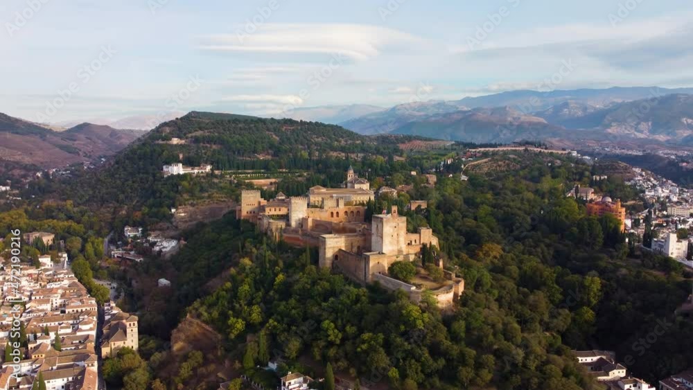 The medieval complex of Alhambra. Flying around Granada at sunrise, Spain, UHD, 4K The medieval complex of Alhambra. Flying around Granada at sunrise, Spain, UHD, 4K