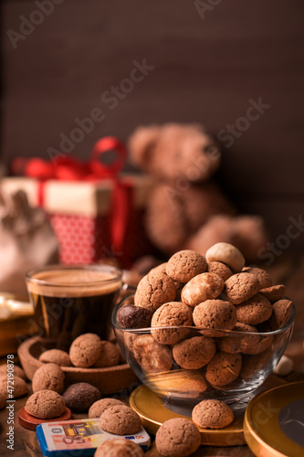 Dutch holiday Sinterklaas. kruidnoten cookies sweets, chocolate and a gift for the child. Children party Saint Nicholas day five december. espresso coffee and sweets. space for text