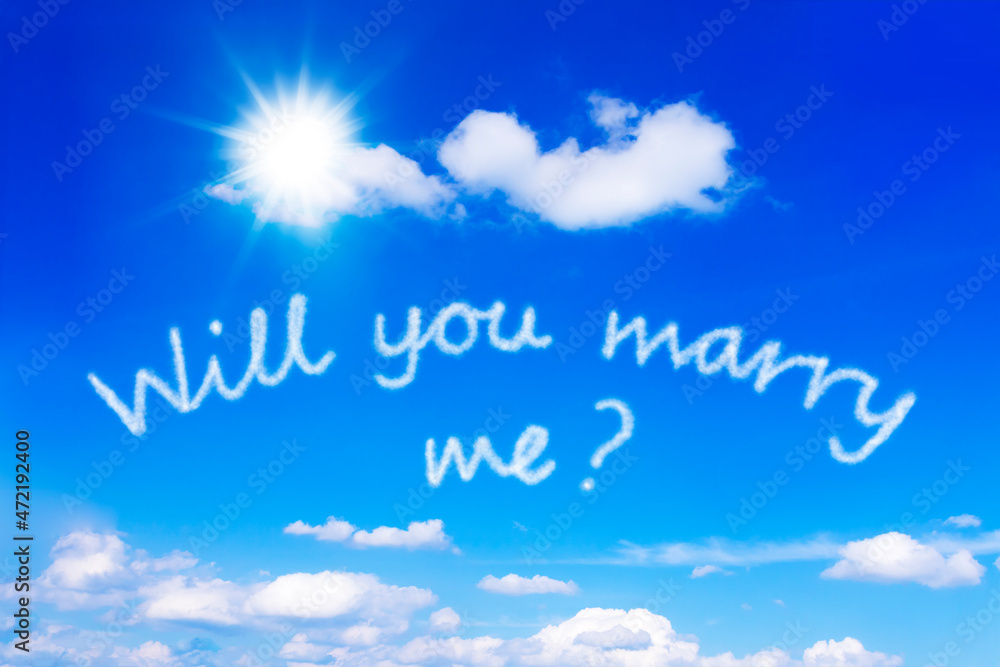 Will you marry me message written on a sunny blue sky. Very romantic template for a proposal of marriage. Will you marry me message written on a sunny blue sky. Very romantic template for a proposal of marriage.