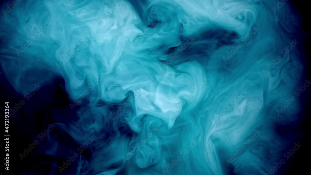 Fluid art ink splash motion. Blue smoke cloud puff flow on black abstract art background Fluid art ink splash motion. Blue smoke cloud puff flow on black abstract art background
