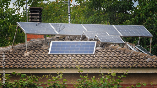 Image with photovoltaic solar panels placed on the roof of a residential house