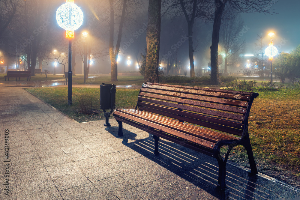 Night in the city Park in Late Autumn. Night in the Park. Wood Benches and Park Alley. Horizontal Photography. landscape scenery