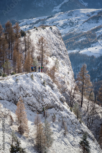 Hikers on the top of a cliff at Scarita Belioara, Transylvania, Romania photo