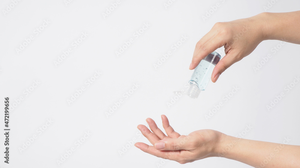 Hands is hold and squeezing alcohol hand gel on white background. Hands is hold and squeezing alcohol hand gel on white background.