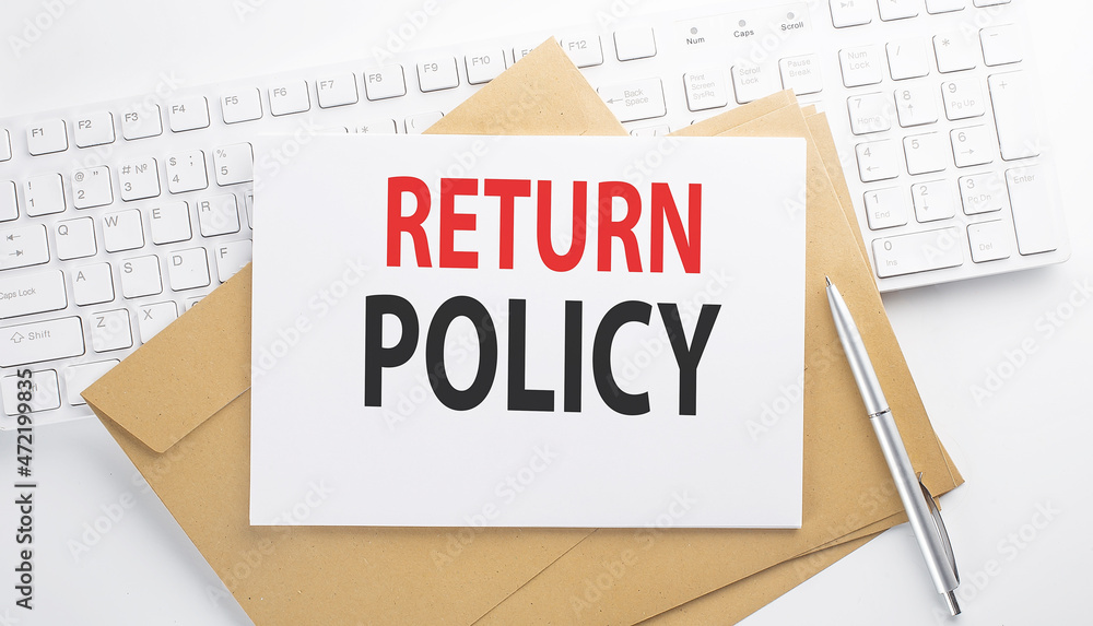 Text RETURN POLICY on envelope on the keyboard Text RETURN POLICY on envelope on the keyboard