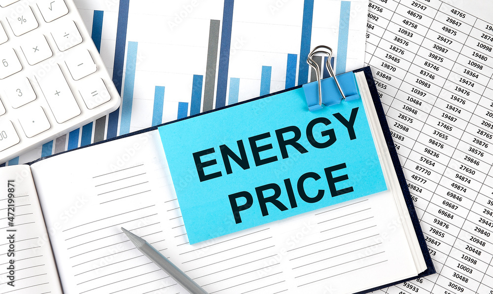 ENERGY PRICE text on blue sticker on the chart background near calculator ENERGY PRICE text on blue sticker on the chart background near calculator