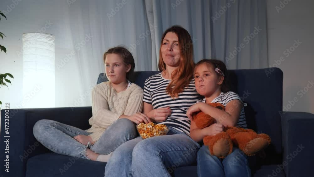 stay home. family - mom, daughter and small child are watching tv. coronavirus happy family together concept. happy family watching tv together. kid dream quarantine. people watching online movies stay home. family - mom, daughter and small child are watching tv. coronavirus happy family together concept. happy family watching tv together. kid dream quarantine. people watching online movies