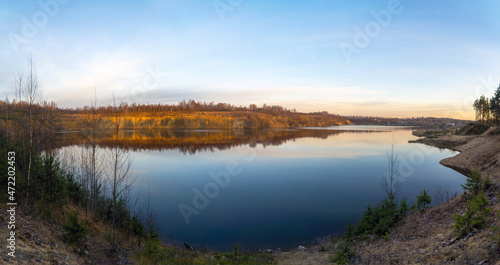 The windless surface of the lake and the reflection of clouds on calm water. Leningrad region  Vsevolozhsk