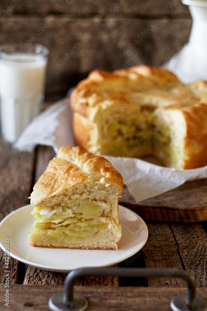 Homemade potato pie. Yeast dough. Wooden background, side view. Homemade potato pie. Yeast dough. Wooden background, side view.