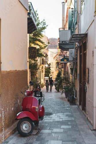 Urban are with restaurants and bars on narrow street in famous Mediterranean town of Nafplio  Greece