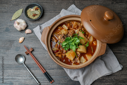 Delicious stewed mutton with radish in casserole photo