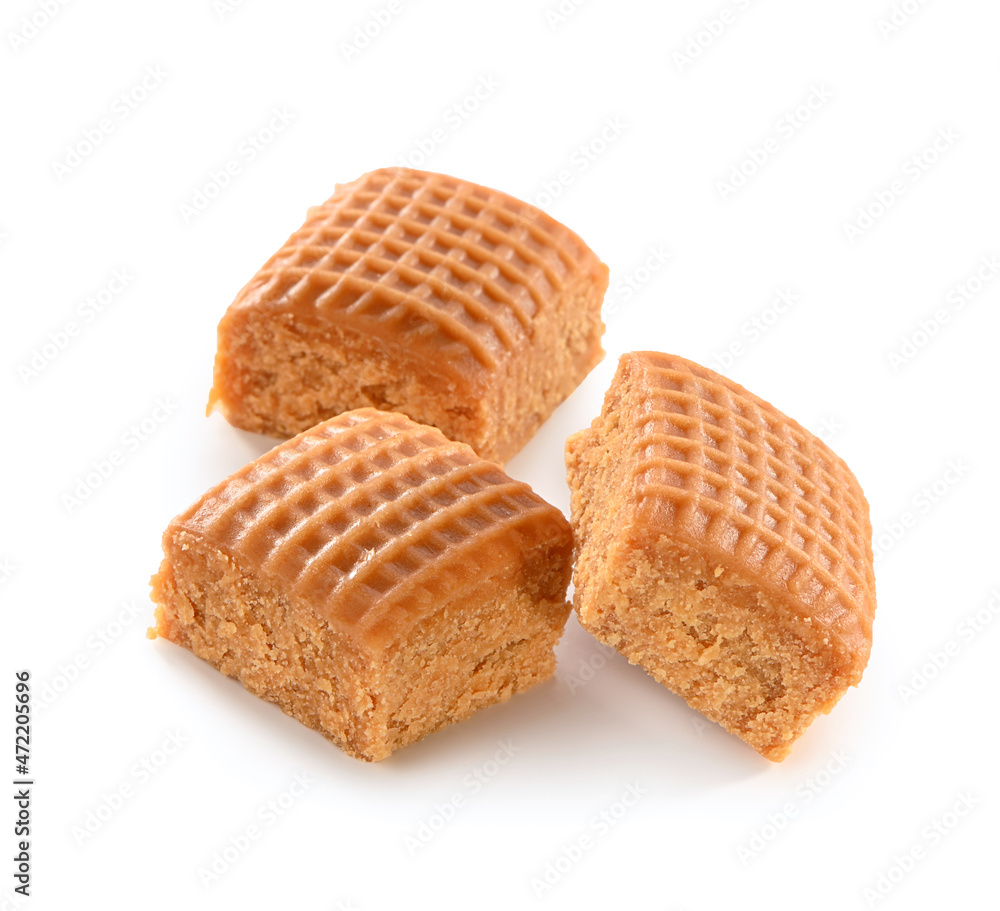three cubes of checkered creamy toffee close-up isolated on white background with shadow
three cubes of checkered creamy toffee close-up isolated on white background with shadow