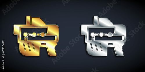 Gold and silver Futuristic space gun blaster icon isolated on black background. Laser Handgun. Alien Weapon. Long shadow style. Vector