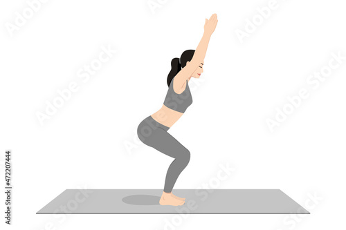Chair Pose, Fierce Pose, Beautiful girl practice Utkatasana. Young attractive woman practicing yoga exercise. working out, black wearing sportswear, grey pants and top, indoor full length, calmness