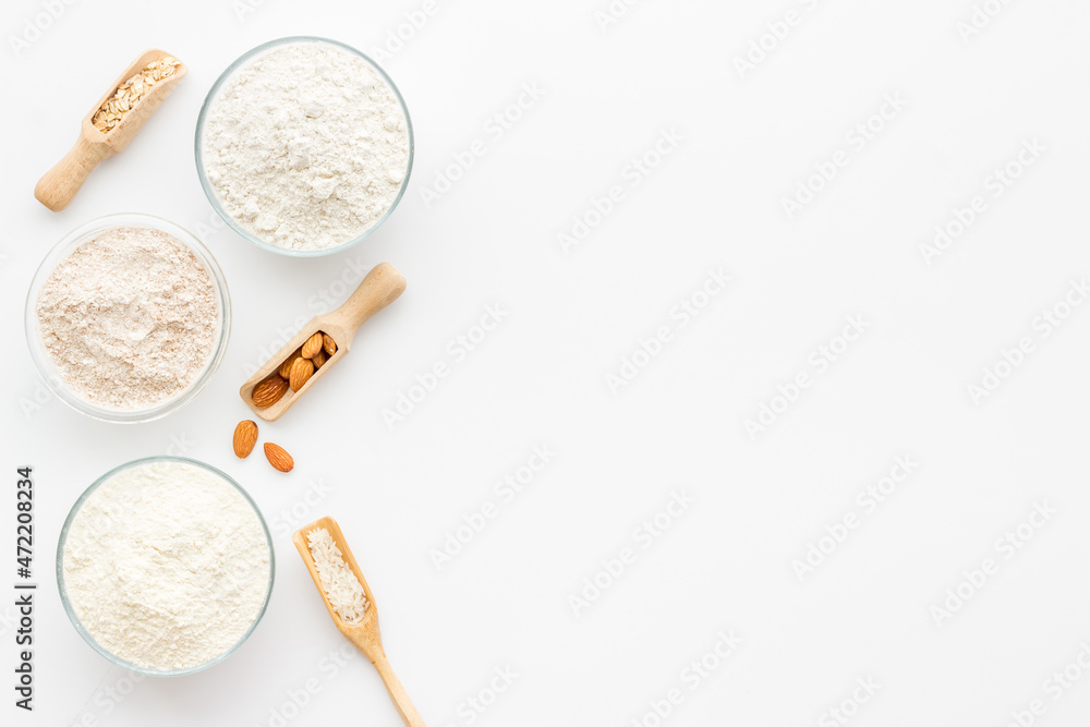 Fototapeta premium Gluten free flour for baking - nuts and grains flour in many bowls