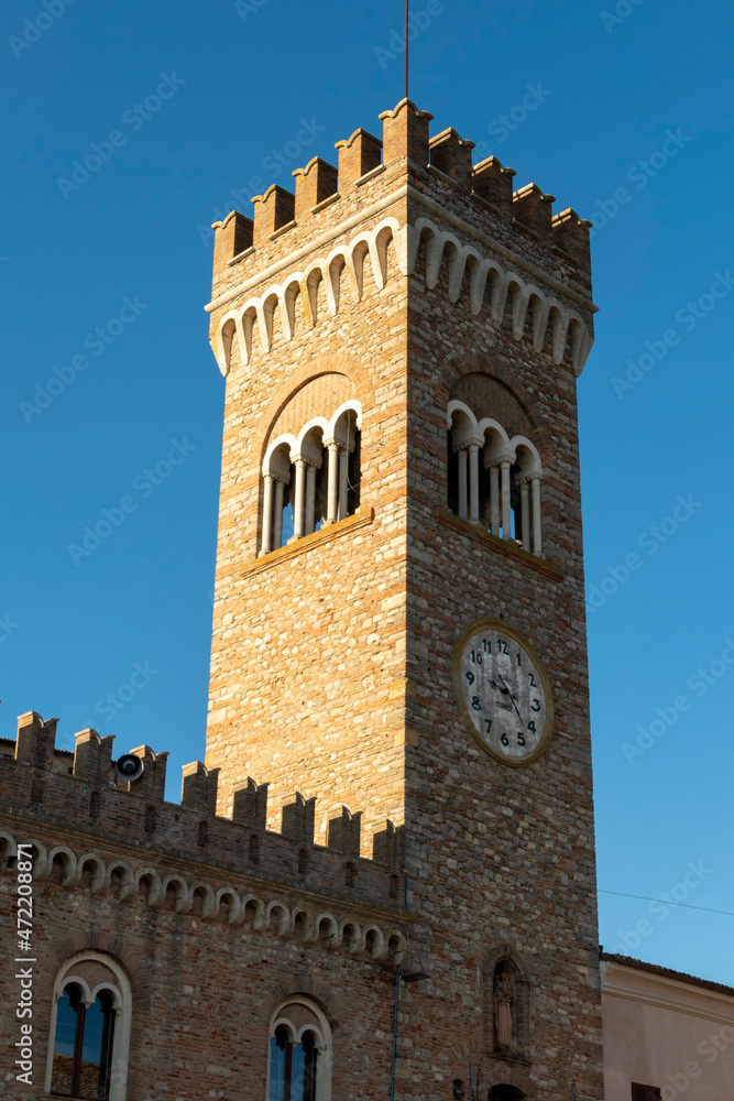 the civic tower adjacent to the town hall of bertinoro with its characteristic brick walls