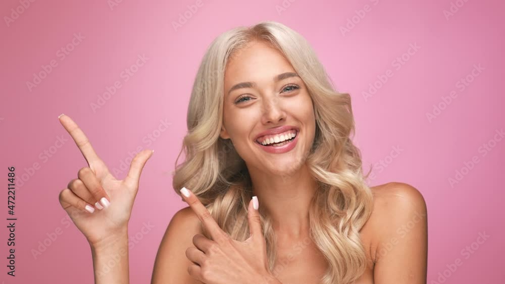 Cute wavy lady point fingers empty space isolated pastel color background Cute wavy lady point fingers empty space isolated pastel color background