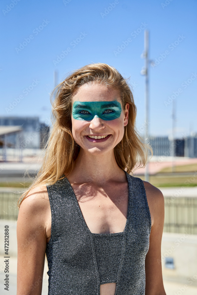 Happy woman with eye make-up on sunny day Happy woman with eye make-up on sunny day