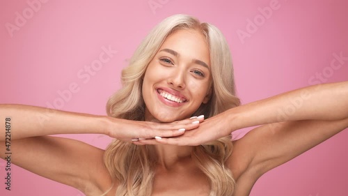 Lovely stunning gorgeous lady touch hand chin isolated pastel color background photo