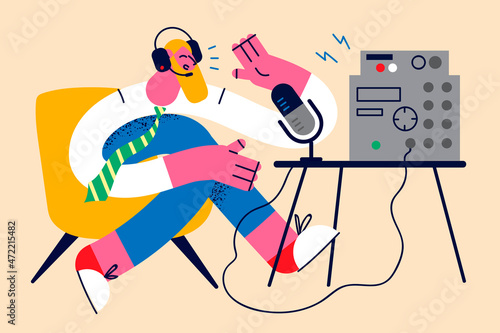 Smiling man talk on radio on microphone 