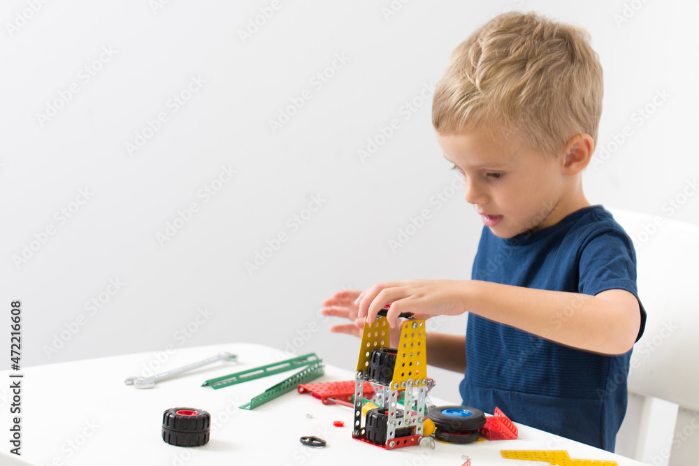 needlework, hand work
a little boy collects a children's designer from metal needlework, hand work
a little boy collects a children's designer from metal