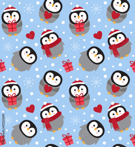 Vector seamless pattern of flat Christmas penguin isolated on blue background