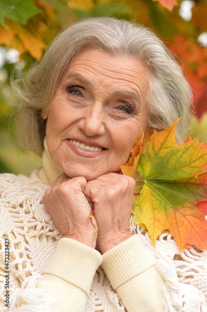 Close up portrait of happy senior beautiful woman in park Close up portrait of happy senior beautiful woman in park