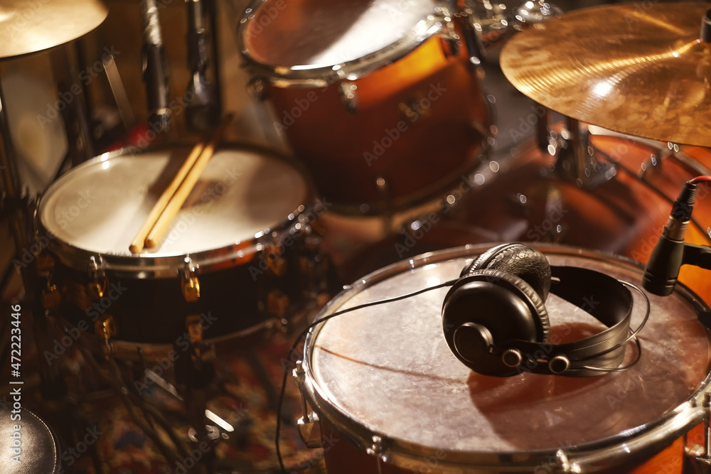 Obraz premium Black Headphones on Studio Drums. Beautiful Closeup Concept Recording Studio or Concert Hall Tools. Musical Background