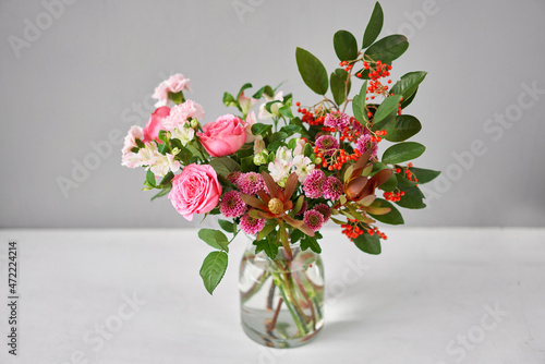 Finished flower arrangement in a vase for home. Flowers bunch, set for interior. Fresh cut flowers for decoration home. European floral shop. Delivery fresh cut flower. photo