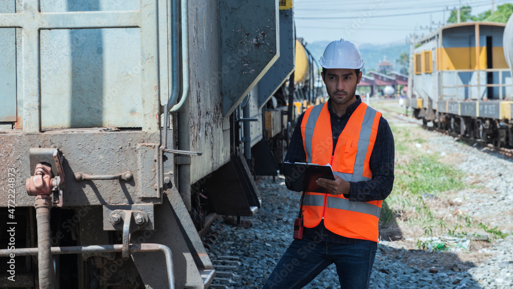 train on the railway station. people using radio communication with Bogie on background. train on the railway station. people using radio communication with Bogie on background.