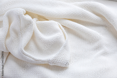 White knitted wool texture background. Winter concept
