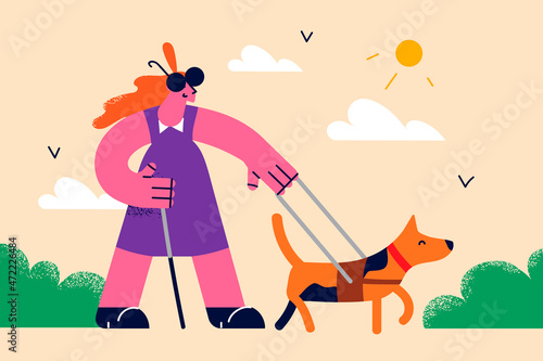 Blind woman walking with trainer guide dog