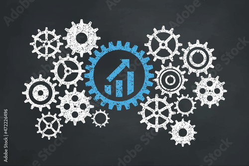 Growing business concept with gear on the blackboard. growth graph icon.