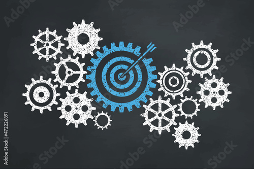The business gear concept on the blackboard. Blue target icon.