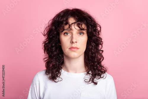 Photo of young attractive woman confident wavy hairstyle casual outfit isolated over pink color background