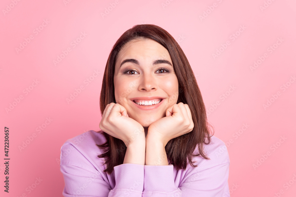 Photo of young cheerful pretty girl arms touch chin dreamy imagination isolated over pink color background Photo of young cheerful pretty girl arms touch chin dreamy imagination isolated over pink color background