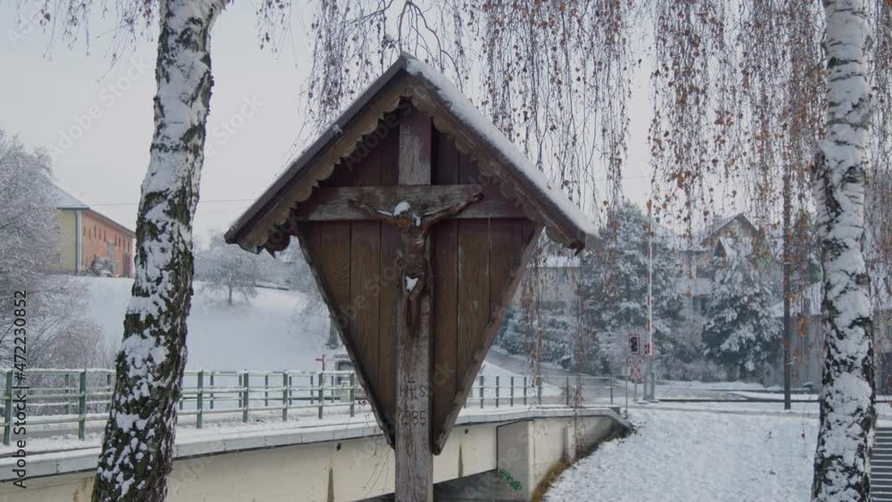 wooden cross between birches in winter wooden cross between birches in winter