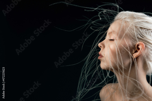 Portrait of a girl with lively curly hair. A young gorgon jellyfish from mythology photo