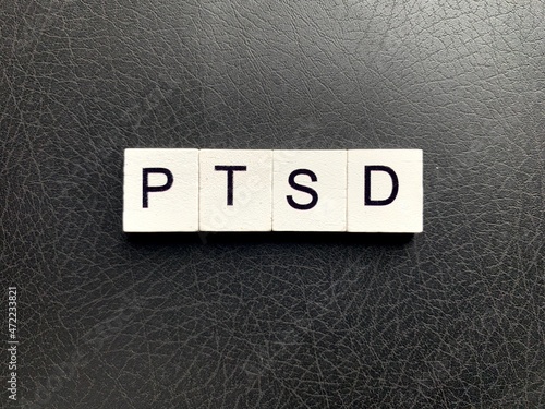 colored squares with the letters ptsd or the words Post-traumatic stress disorder